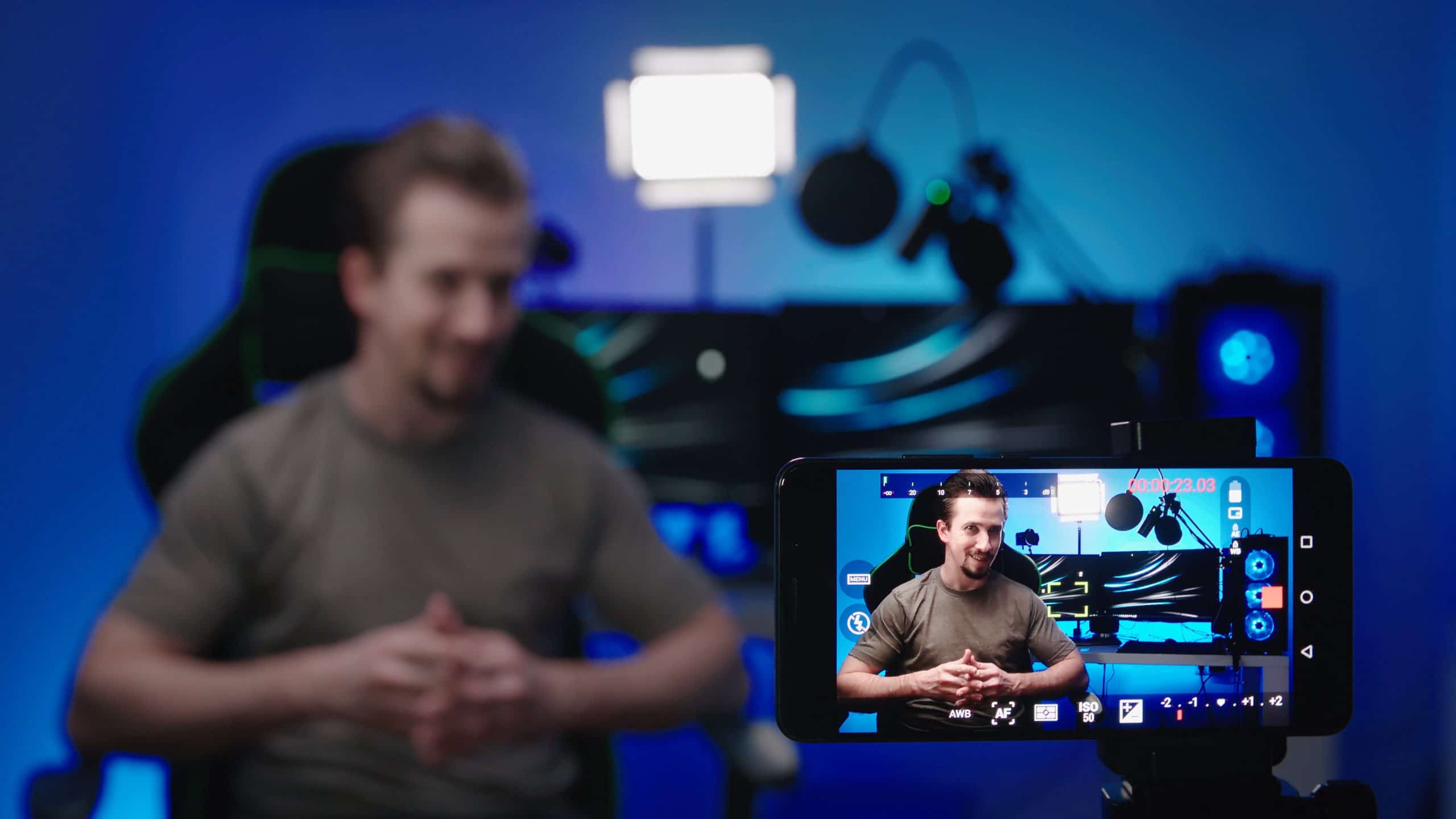 Tech person recording video with smartphone