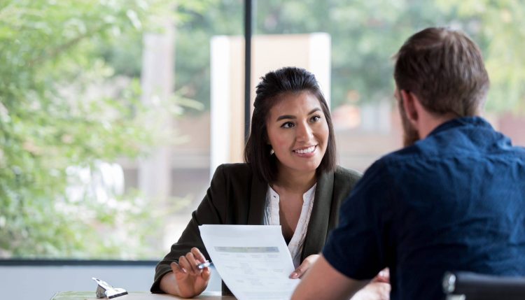 Cheerful businesswoman meets with client